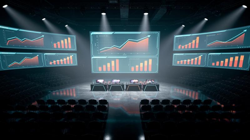 Mobile esports arena with empty seats and declining revenue graphs projected on stadium screens