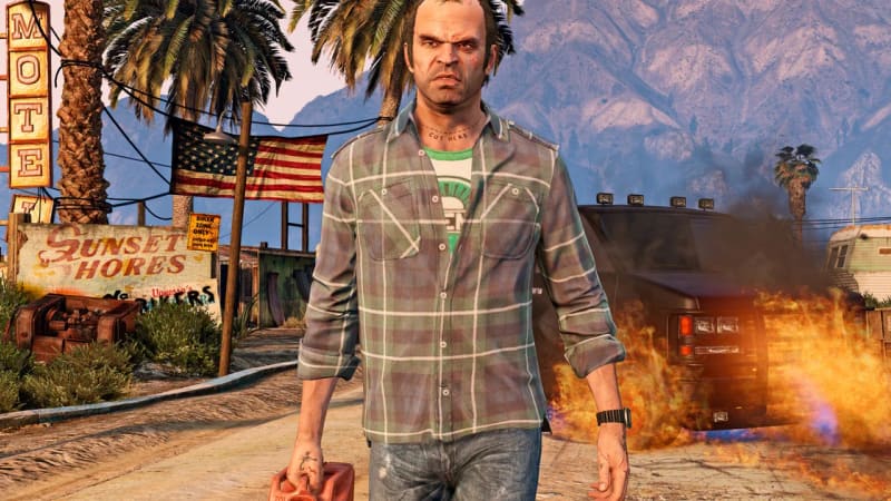 Trevor in GTA 5 carrying a jerry can beside a burning car, Grand Theft Auto Online artwork