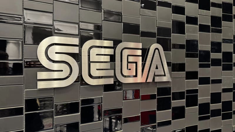 SEGA lettering mounted on a tiled building facade