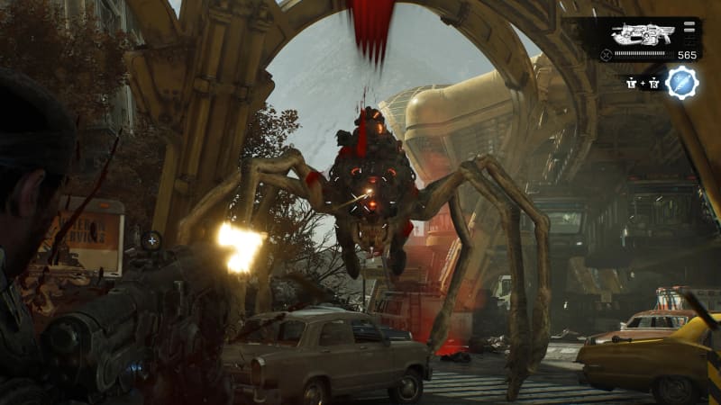 Gears of War combat against a large creature among abandoned cars