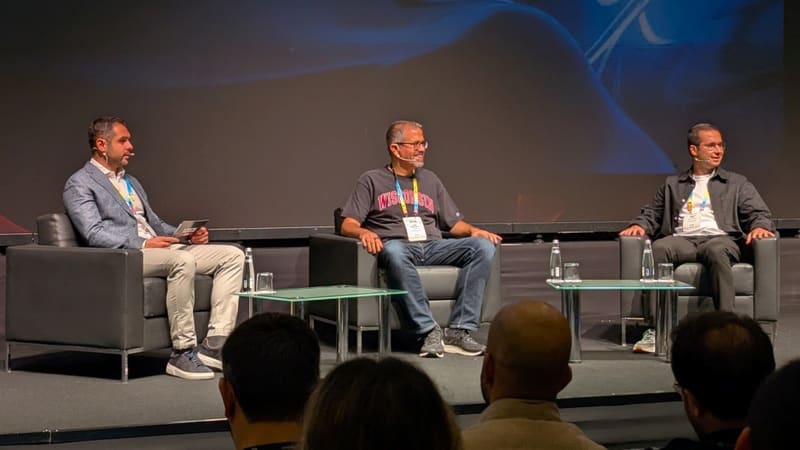 Three speakers on stage at the Mobidictum conference